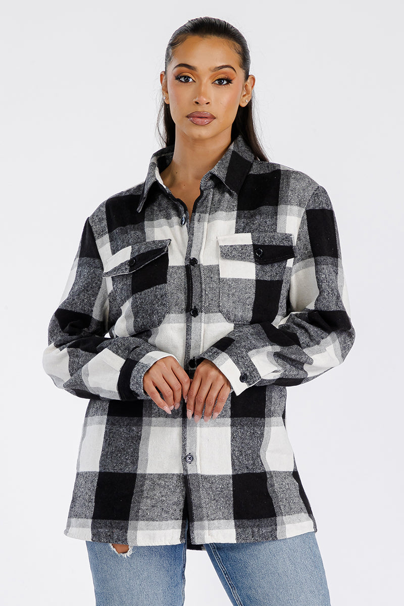 A stylish oversized soft flannel shacket for women, featuring button closure and chest pockets, perfect for layering.