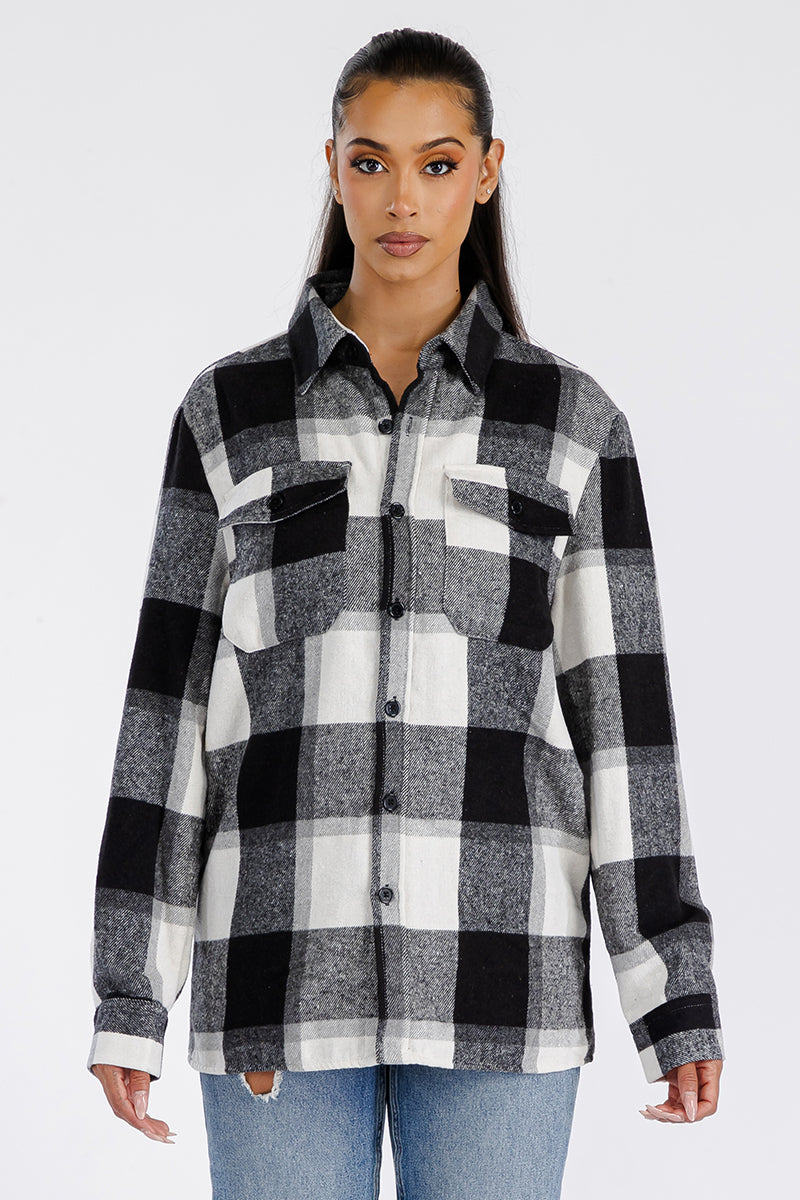 A stylish oversized soft flannel shacket for women, featuring button closure and chest pockets, perfect for layering.