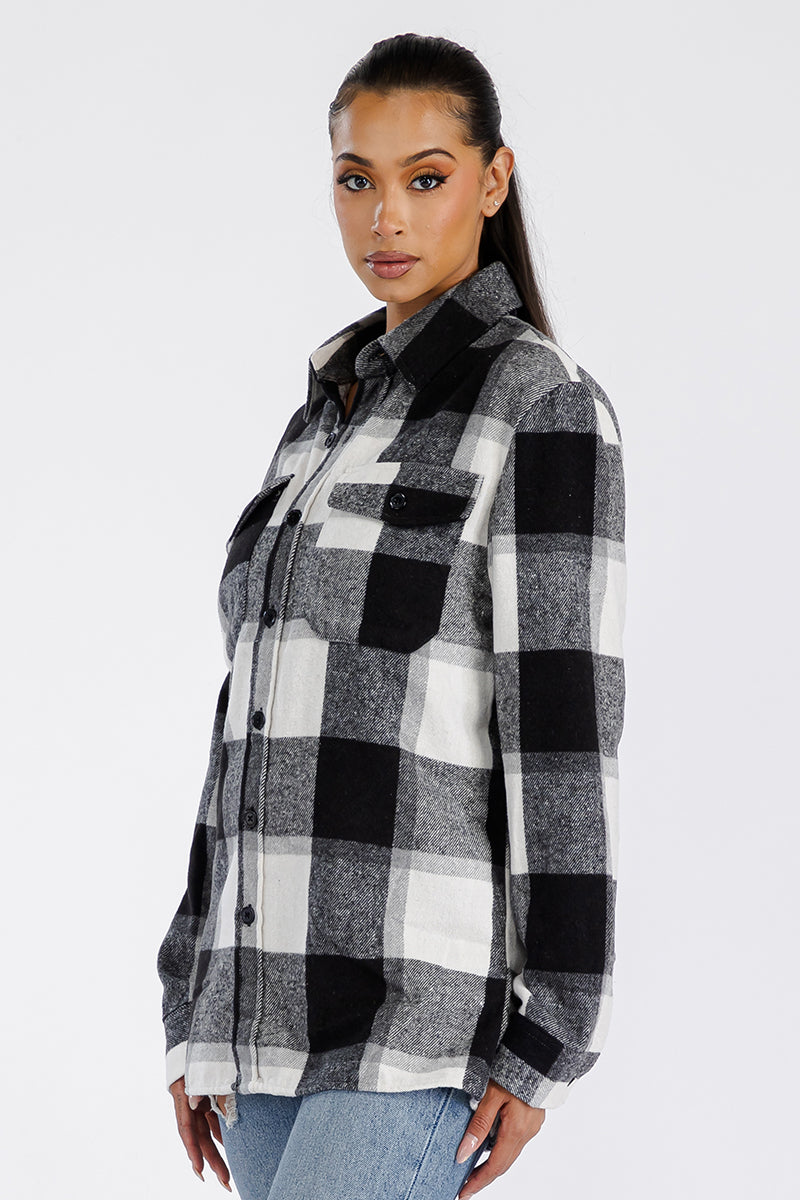 A stylish oversized soft flannel shacket for women, featuring button closure and chest pockets, perfect for layering.