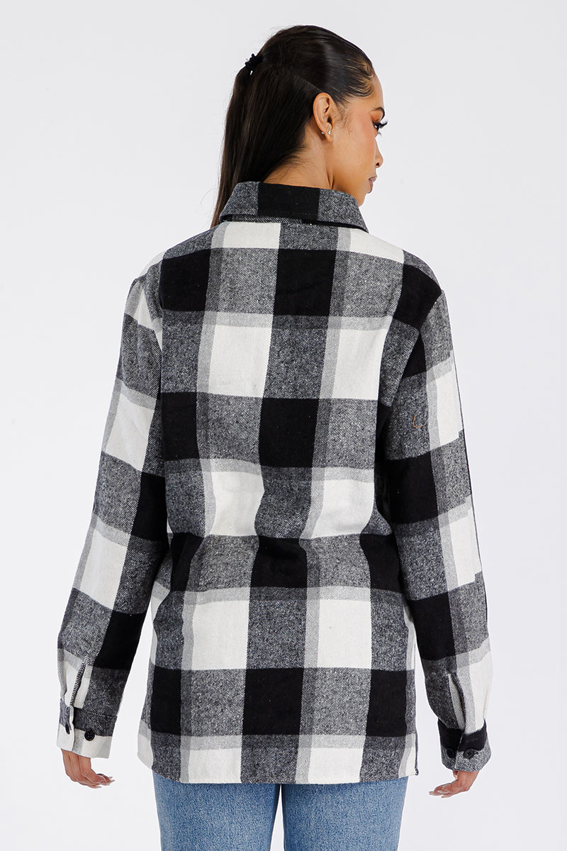 A stylish oversized soft flannel shacket for women, featuring button closure and chest pockets, perfect for layering.