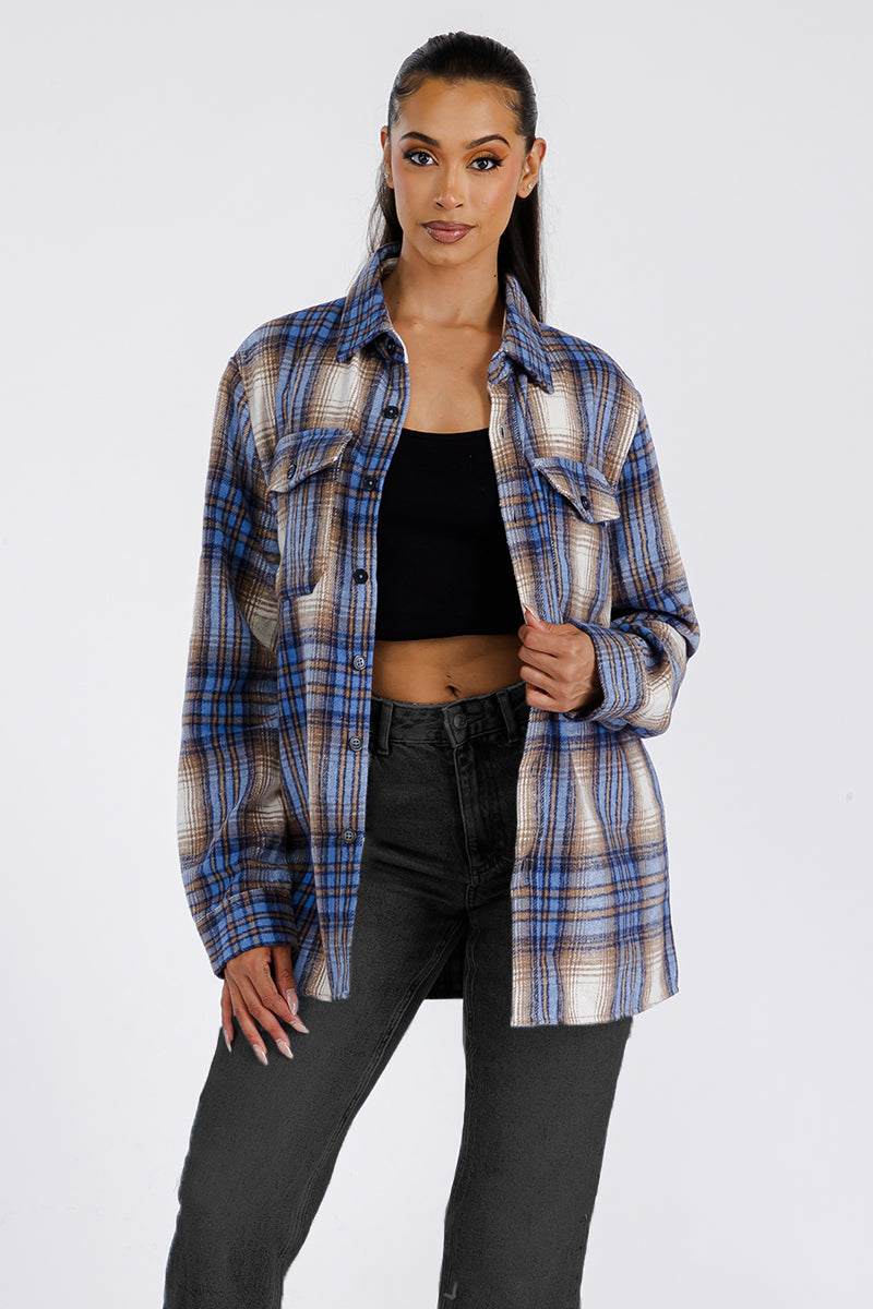 A stylish woman wearing a Boyfriend Oversized Soft Flannel Shacket, featuring button closure and chest pockets, showcasing its soft brushed fabric.