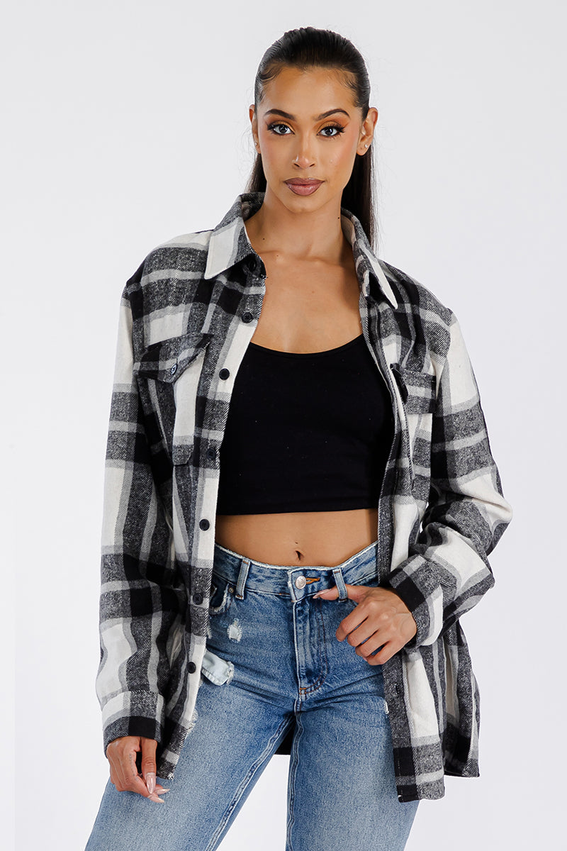 A stylish oversized flannel shacket for women, featuring button closure and chest pockets, made from soft brushed fabric.