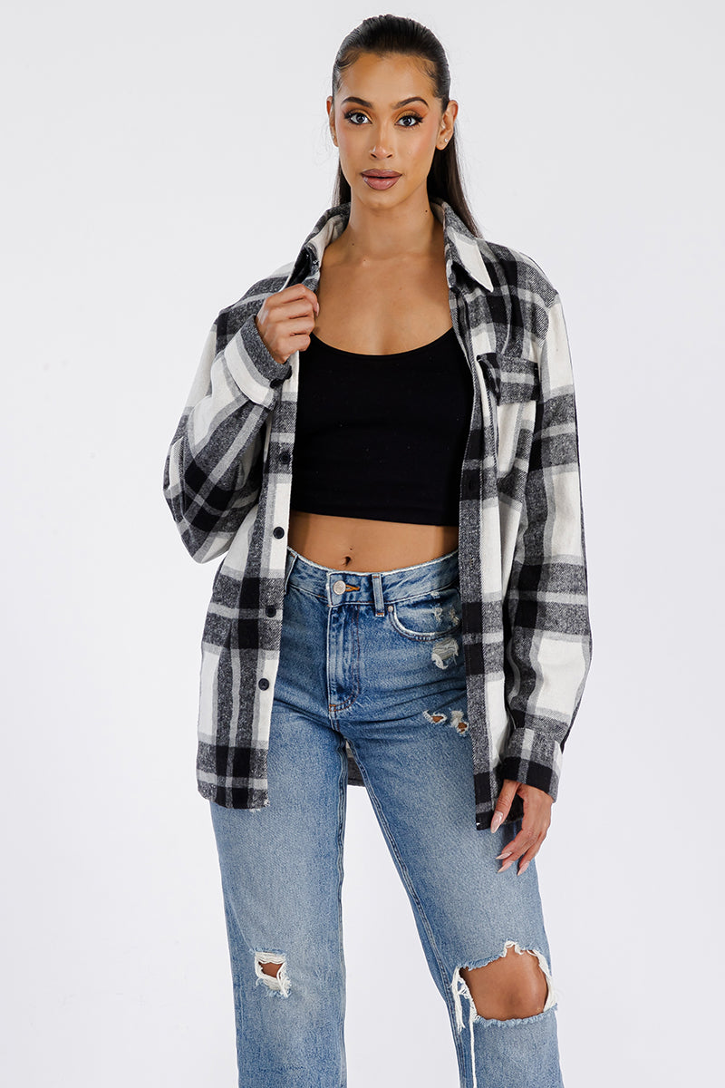 A stylish oversized flannel shacket for women, featuring button closure and chest pockets, made from soft brushed fabric.