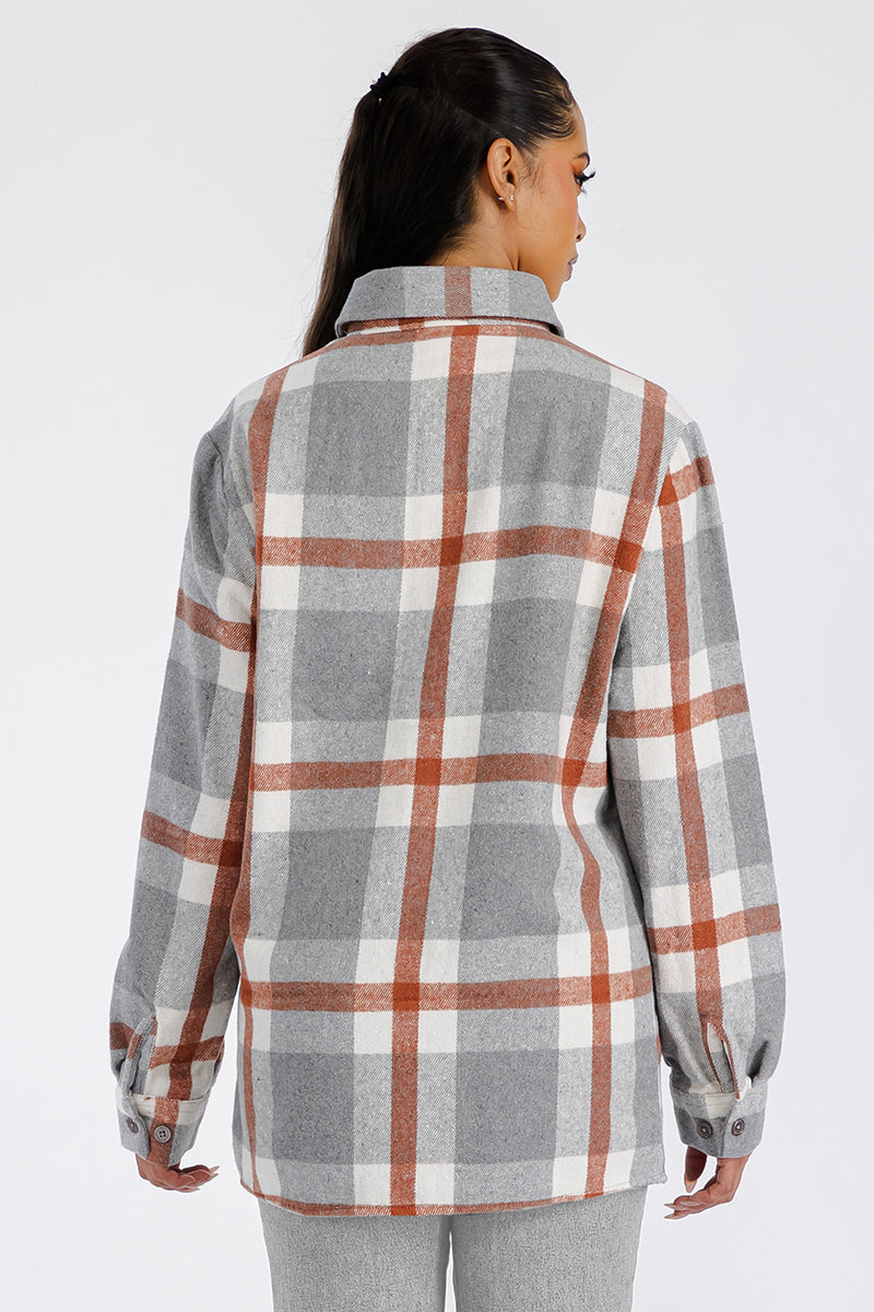 A stylish oversized flannel shacket in soft brushed fabric, featuring button closure and chest pockets, perfect for casual wear.