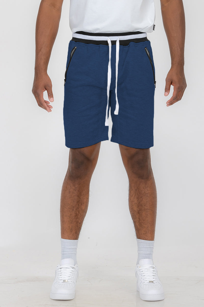 Man wearing blue drawstring shorts.