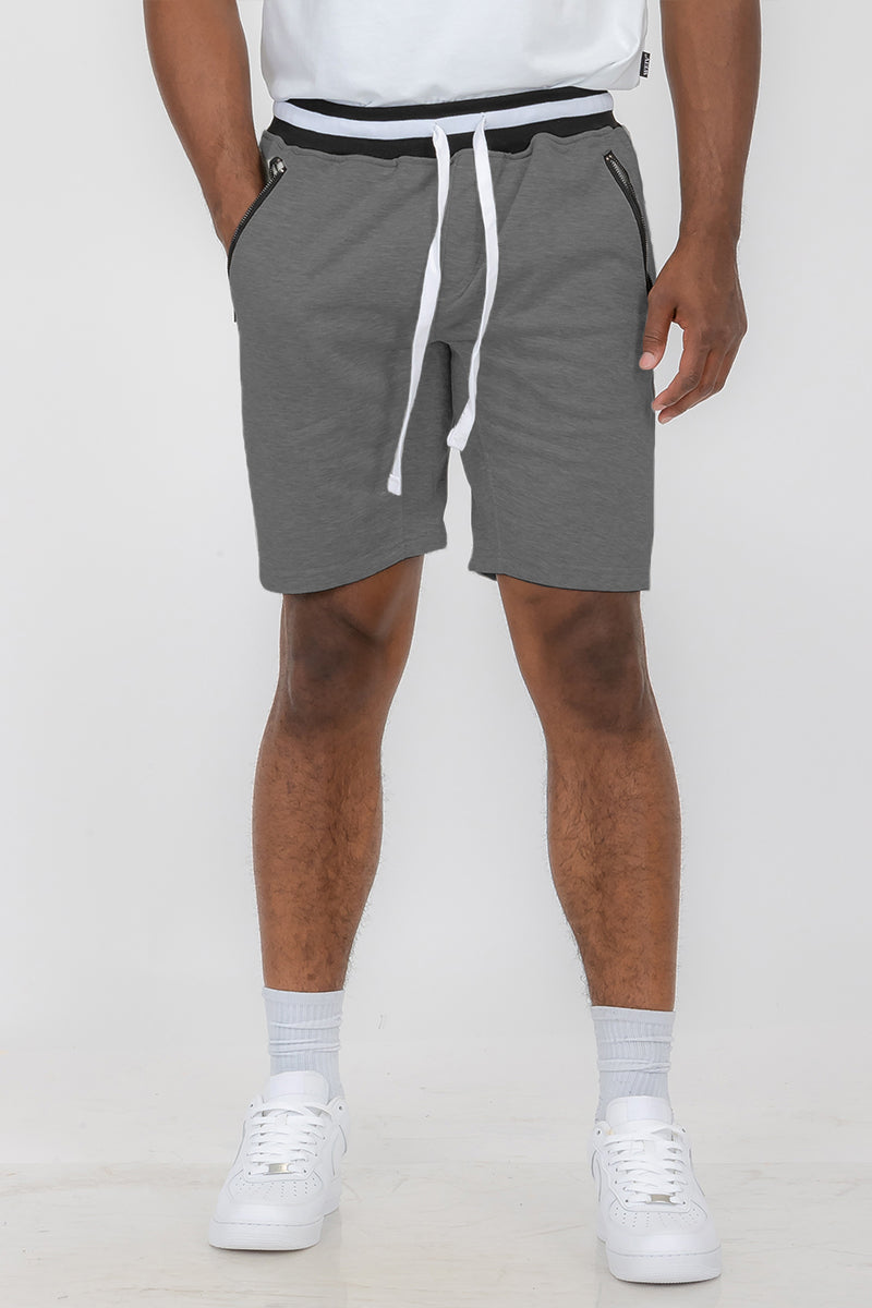 Man wearing gray sweat shorts.