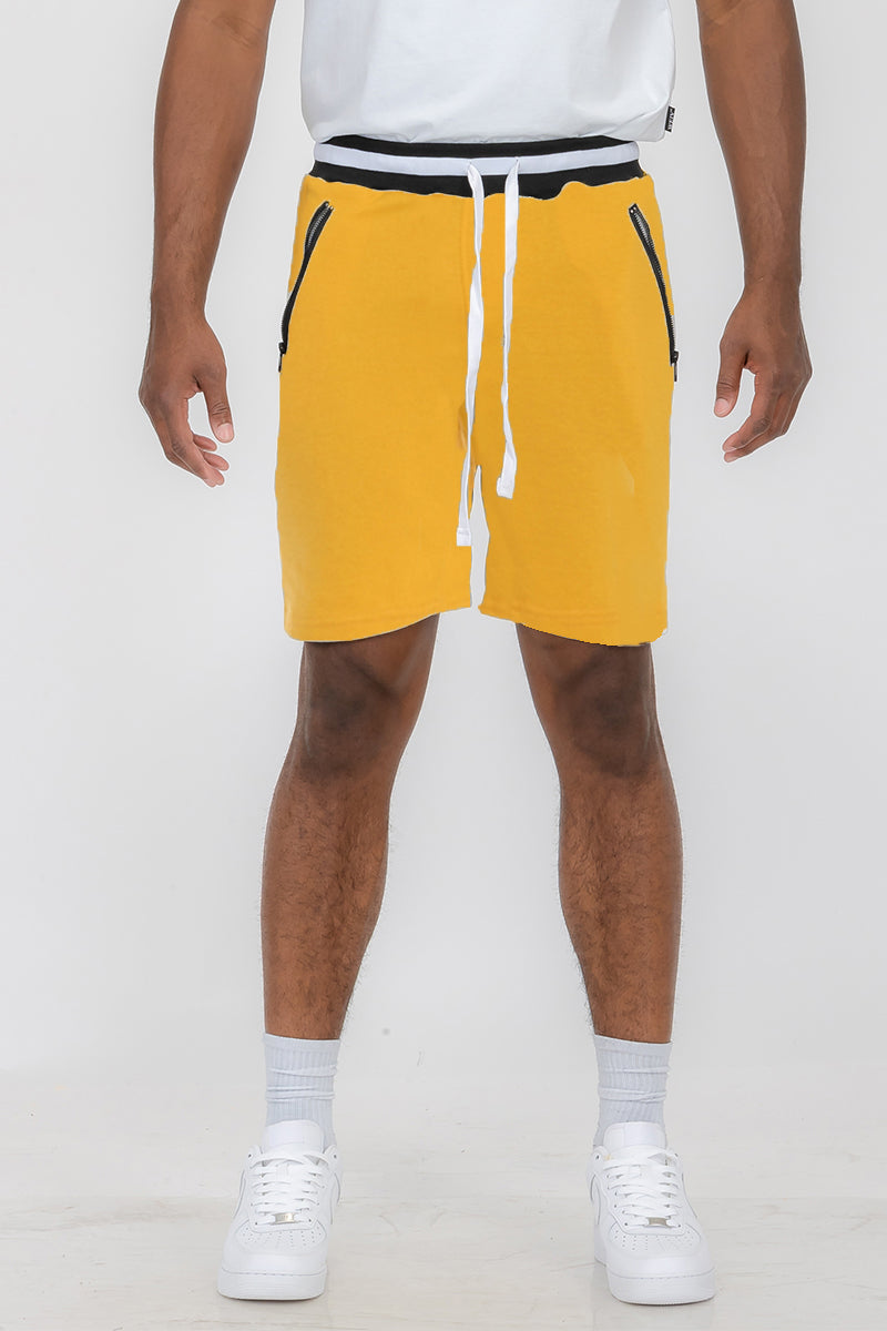 Man wearing yellow shorts.