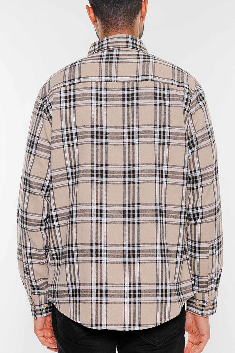 A stylish brushed flannel shirt featuring chest pockets and button closure, perfect for casual wear.