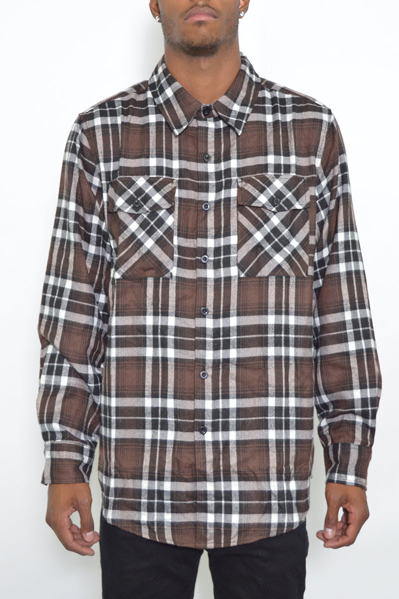 A stylish brushed flannel shirt featuring chest pockets and button closure, perfect for casual wear.