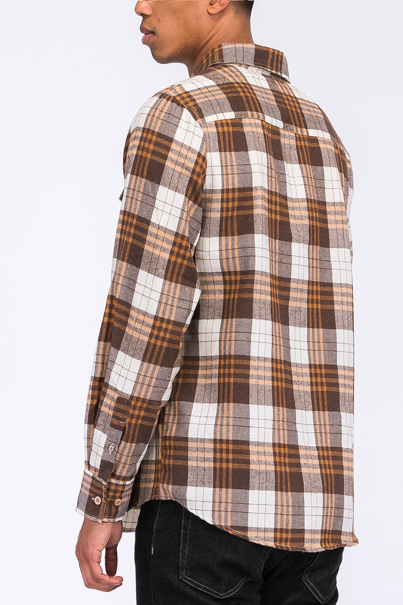 A stylish brushed flannel shirt featuring chest pockets and button closure, perfect for casual wear.