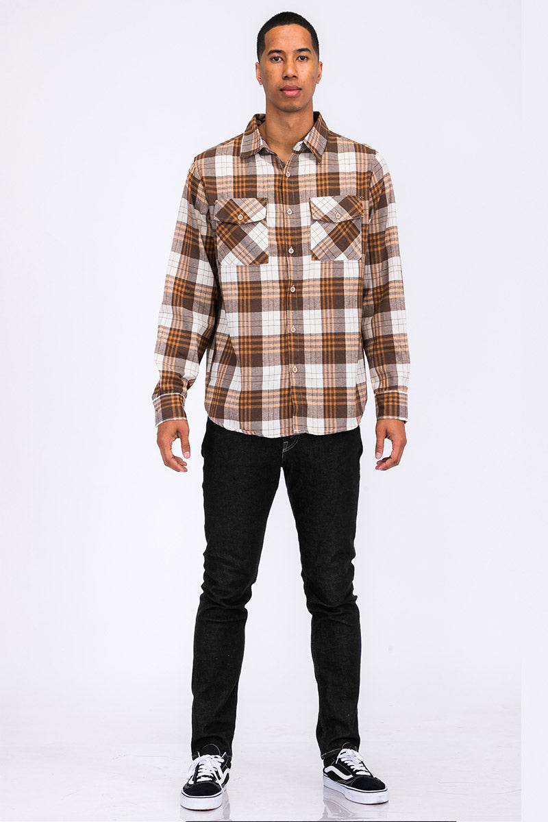 A stylish brushed flannel shirt featuring chest pockets and button closure, perfect for casual wear.