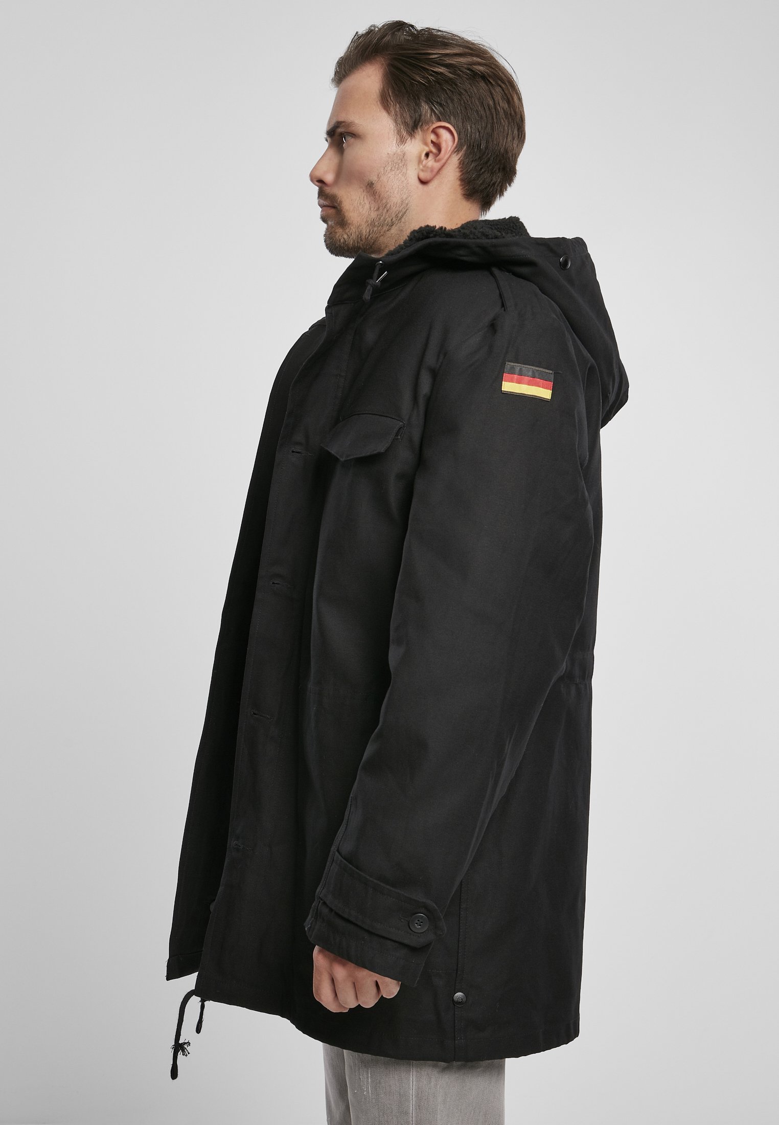 BW Parka featuring a large hood, adjustable waist, and military insignia, perfect for winter wear.