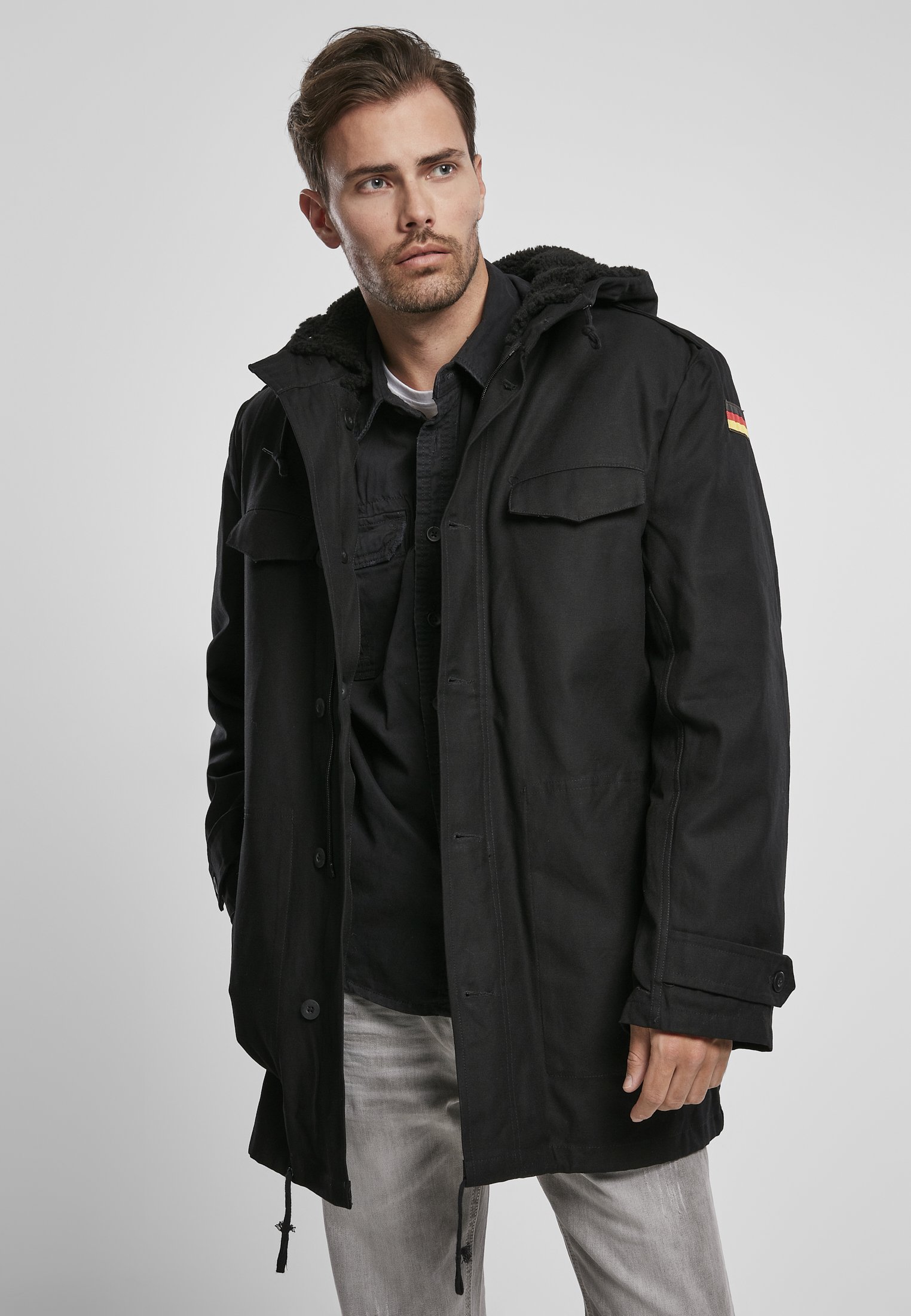 BW Parka featuring a large hood, adjustable waist, and military insignia, perfect for winter wear.