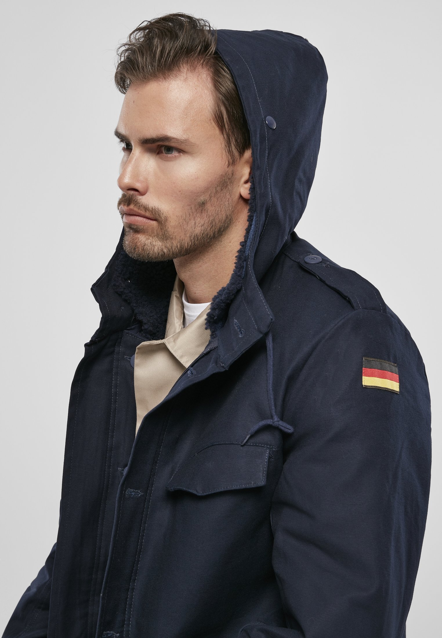 BW Parka featuring a large hood, adjustable waist, and military insignia, perfect for winter wear.