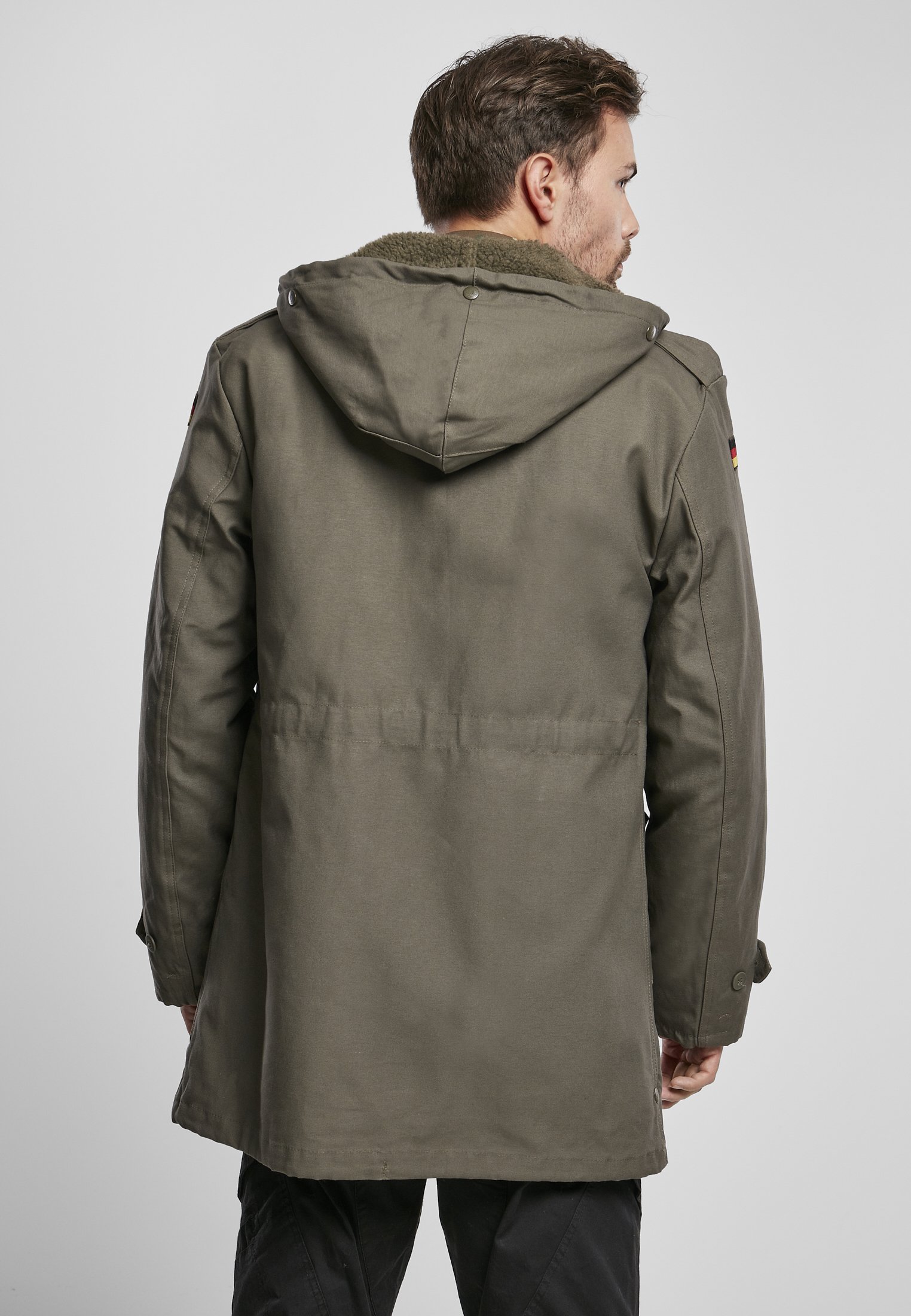 BW Parka featuring a large hood, adjustable waist, and military insignia, perfect for winter wear.