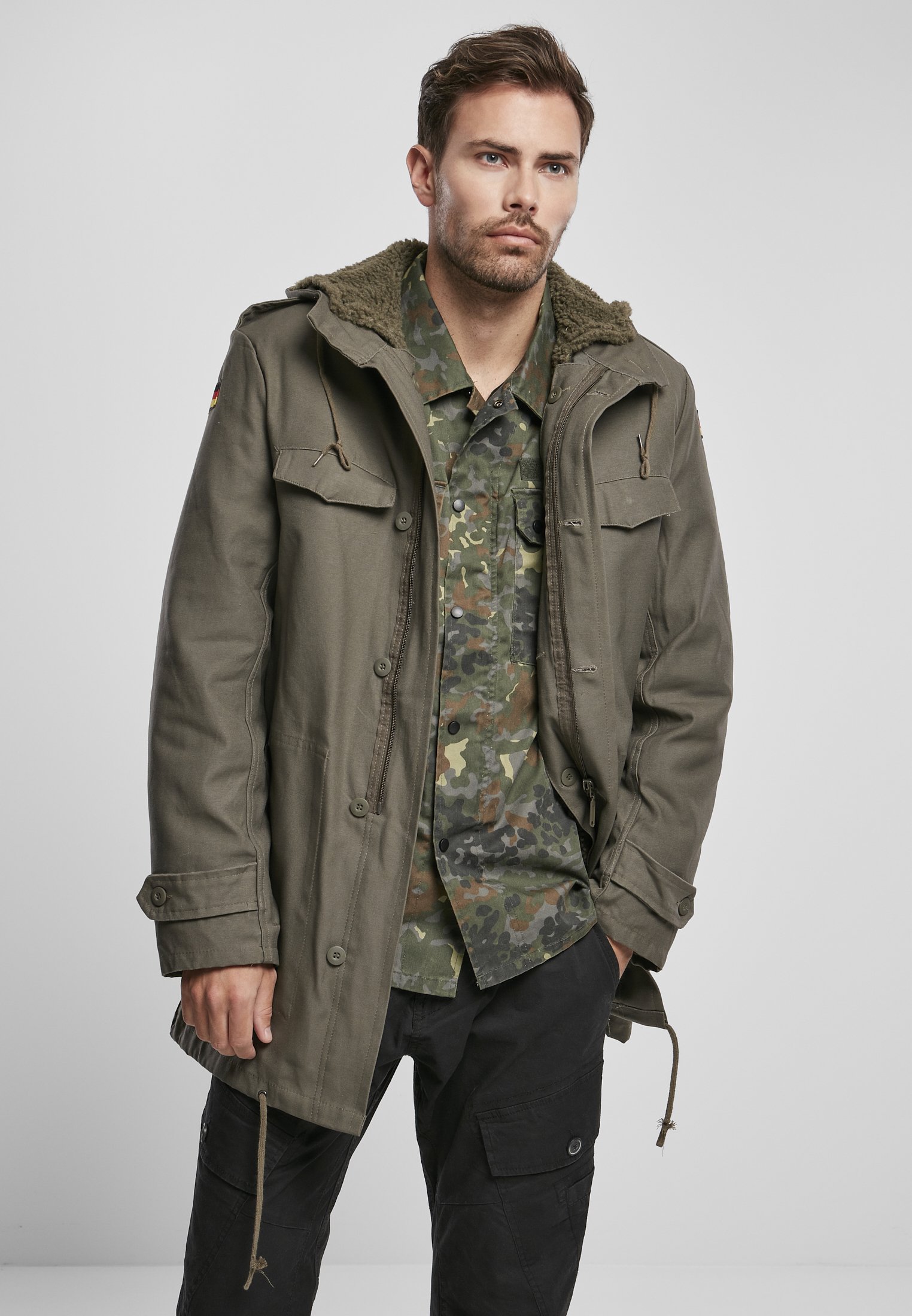 BW Parka featuring a large hood, adjustable waist, and military insignia, perfect for winter wear.