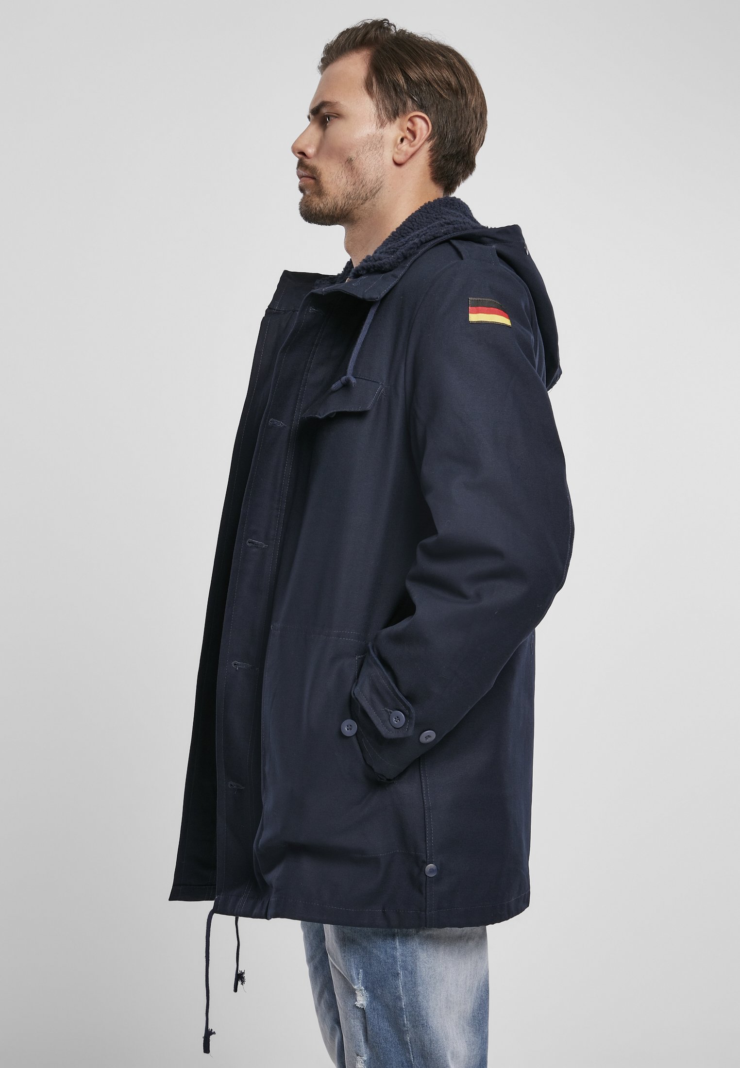 BW Parka featuring a large hood, adjustable waist, and military insignia, perfect for winter wear.