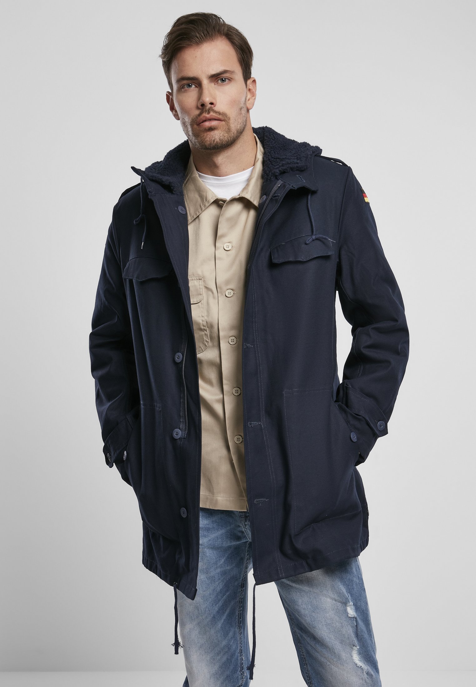 BW Parka featuring a large hood, adjustable waist, and military insignia, perfect for winter wear.