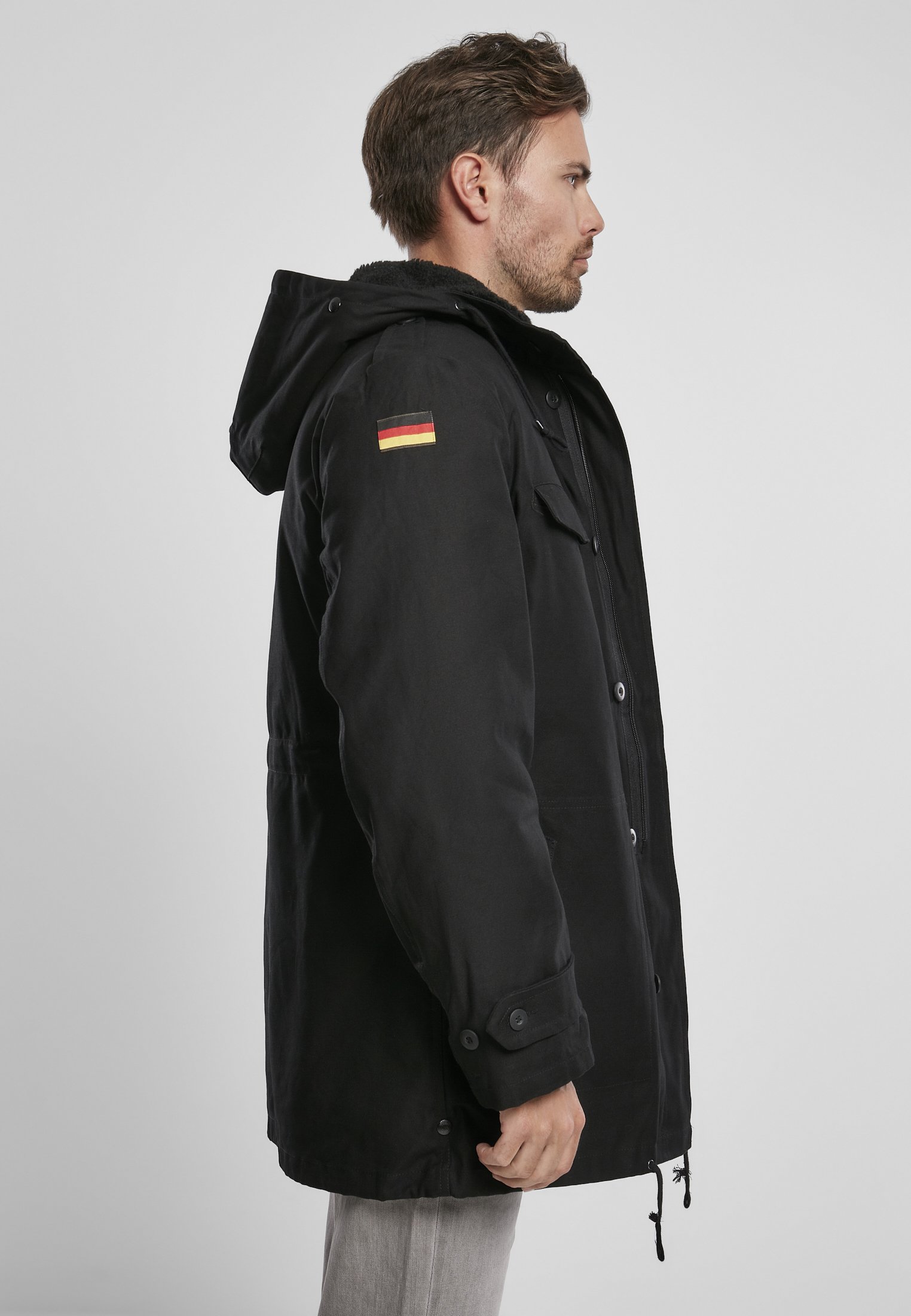 BW Parka featuring a large hood, adjustable waist, and military insignia, perfect for winter wear.