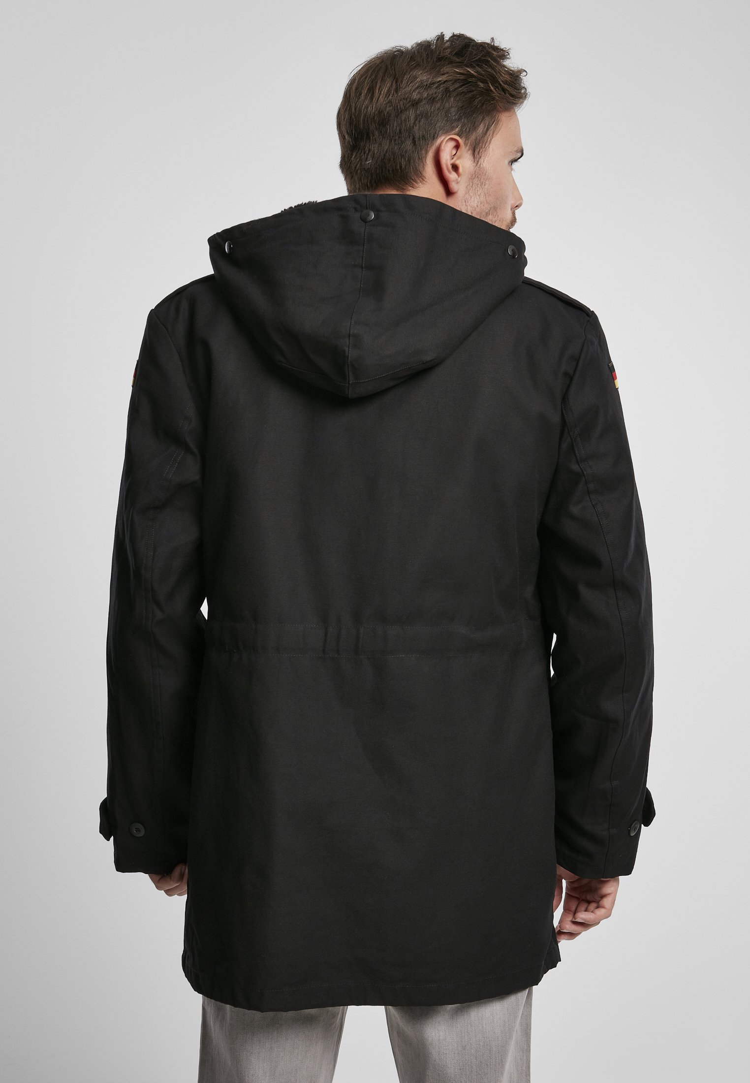 BW Parka featuring a large hood, adjustable waist, and military insignia, perfect for winter wear.