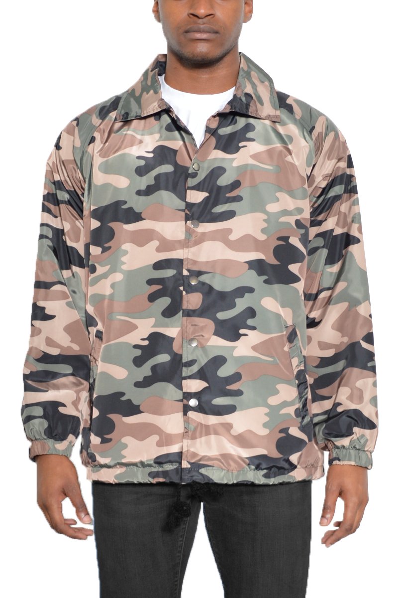 A stylish CAMO COACHS JACKET featuring a camouflage pattern, snap button closure, and multiple pockets, perfect for outdoor activities.