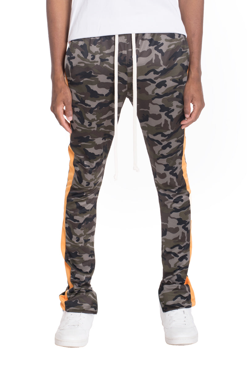 Camo side stripe track pants featuring a bold camouflage print, elastic waist, drawstring, and hidden ankle zipper.