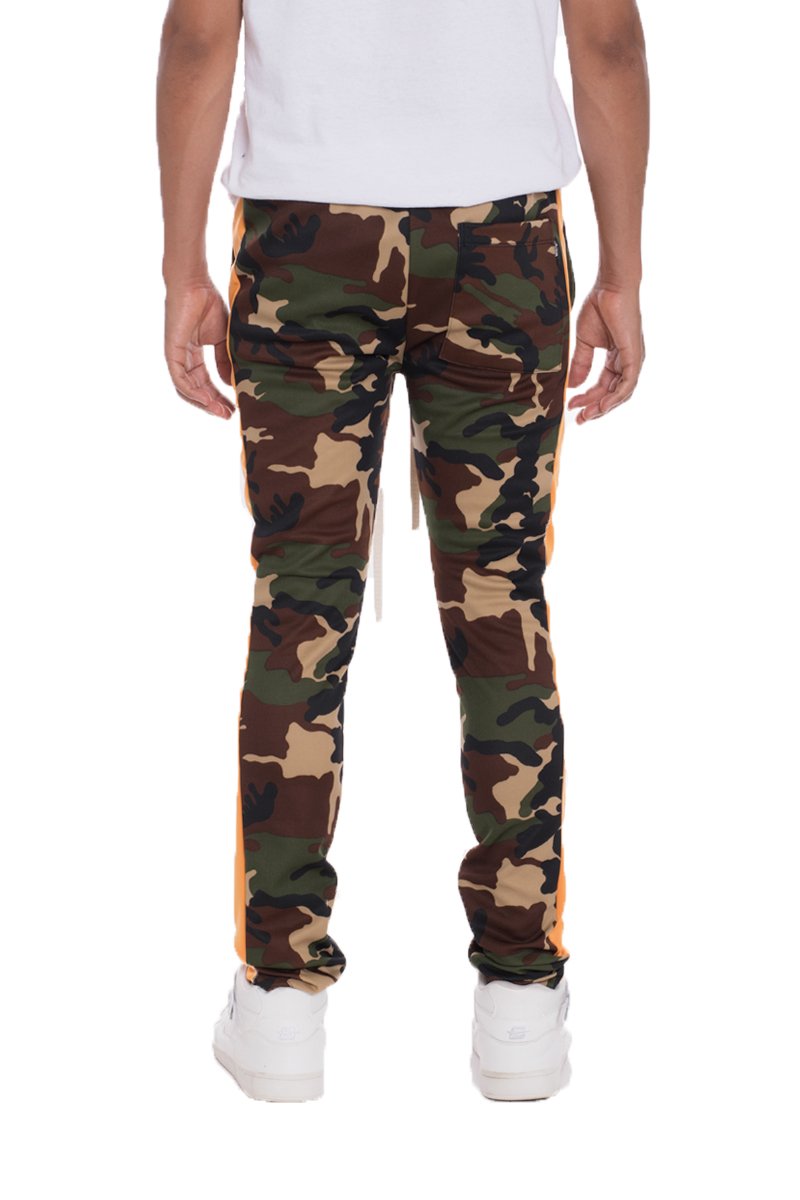 Camo side stripe track pants featuring a bold camouflage print, elastic waist, drawstring, and hidden ankle zipper.