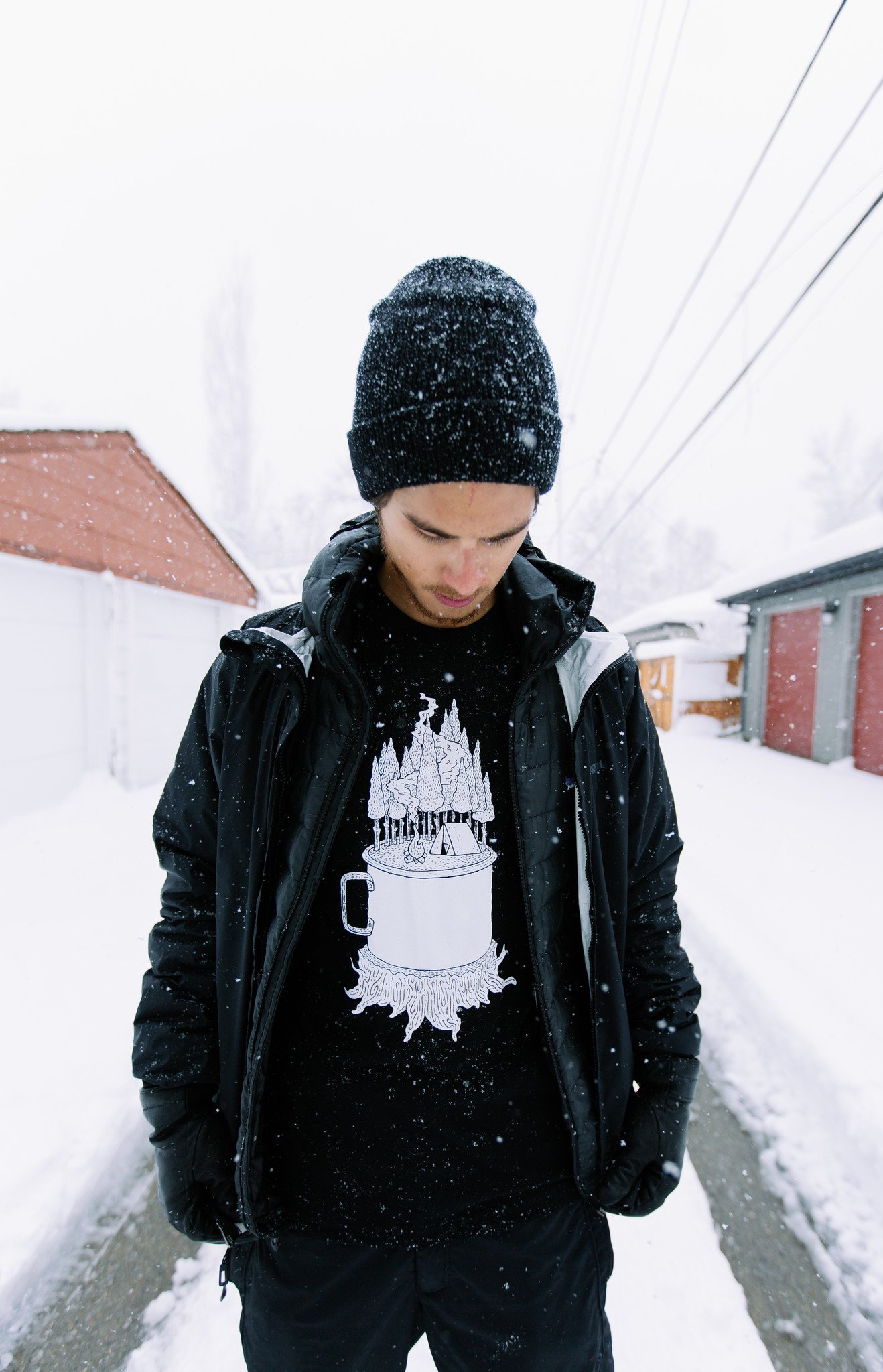 Black Camping Cup Tee featuring a unique camping cup design printed in white water-based ink on a soft cotton fabric.