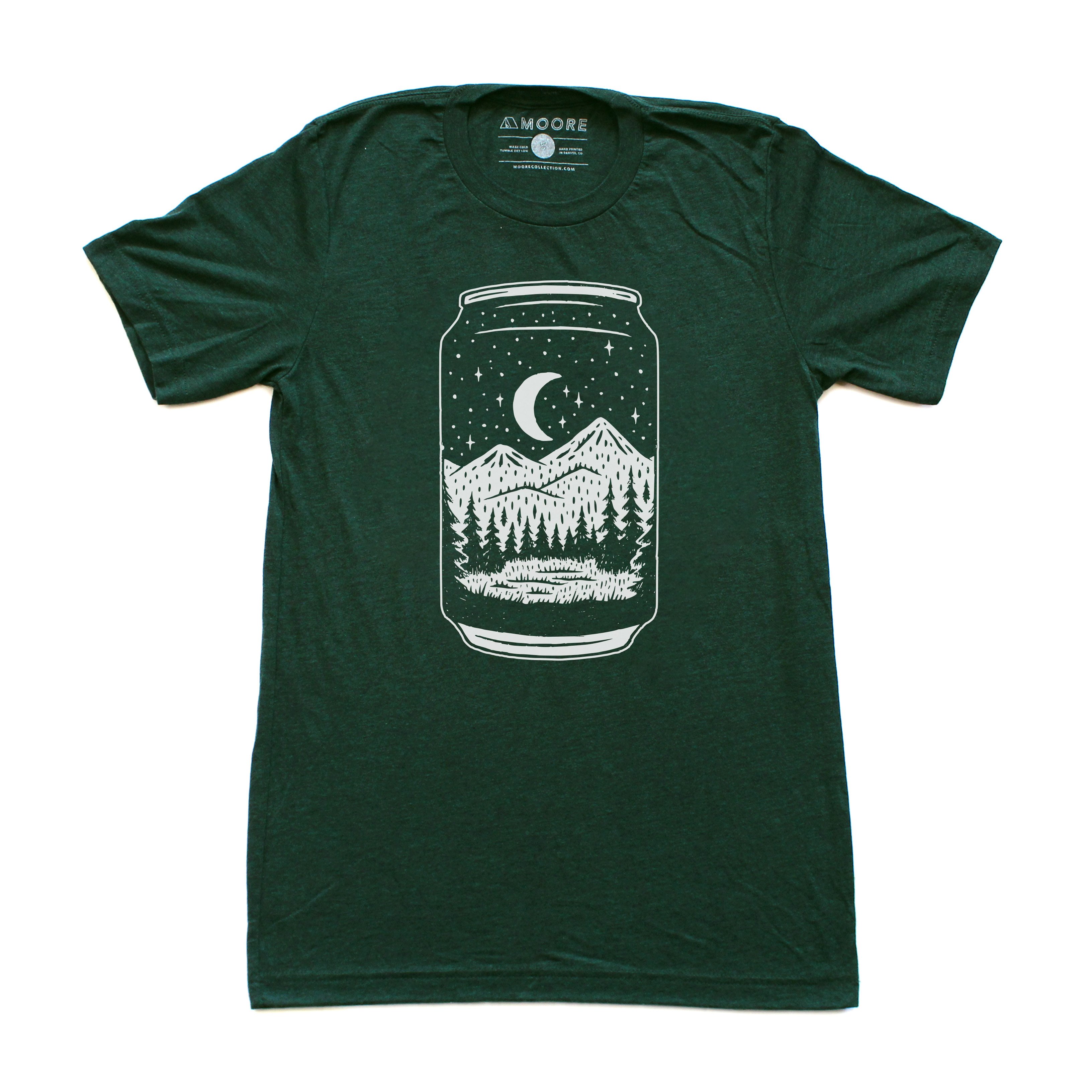 Emerald green Can Tee t-shirt featuring a night forest design, made from a soft tri-blend fabric.