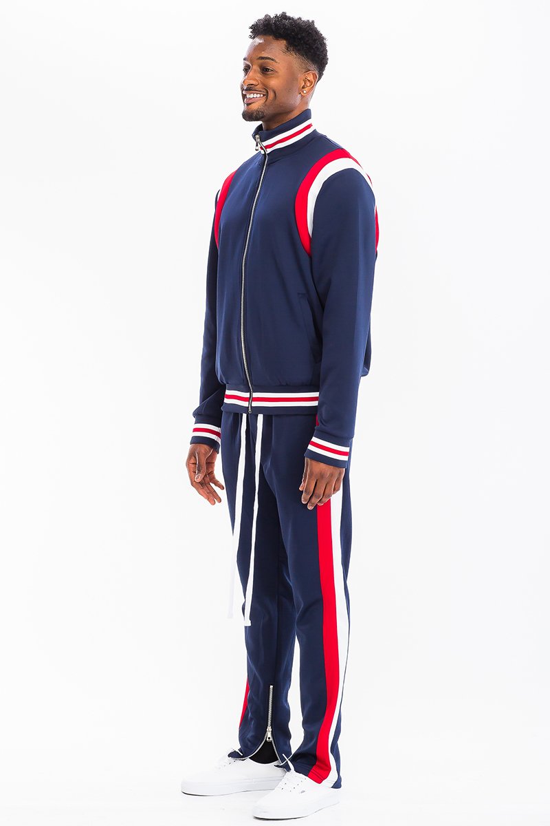 CHEVY TRACK SET featuring a full zip jacket and drawstring pants with dual chevron stripes, perfect for athletic wear.