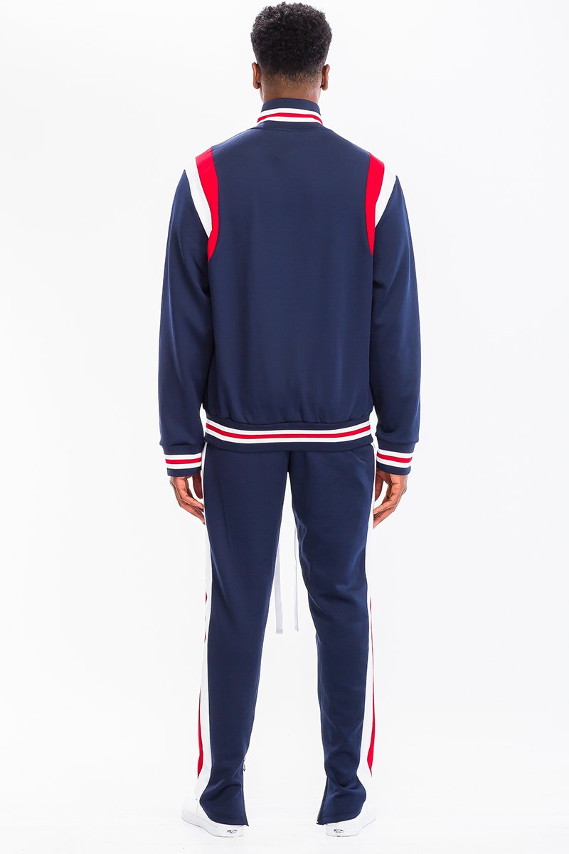 CHEVY TRACK SET featuring a full zip jacket and drawstring pants with dual chevron stripes, perfect for athletic wear.