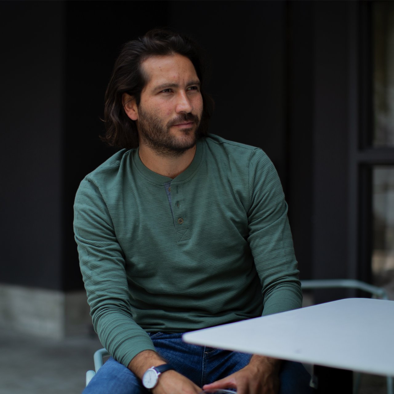 Clark Long Sleeve Henley in mystery green with striped pattern and chambray inner placket, showcasing its stylish design and eco-friendly fabric.