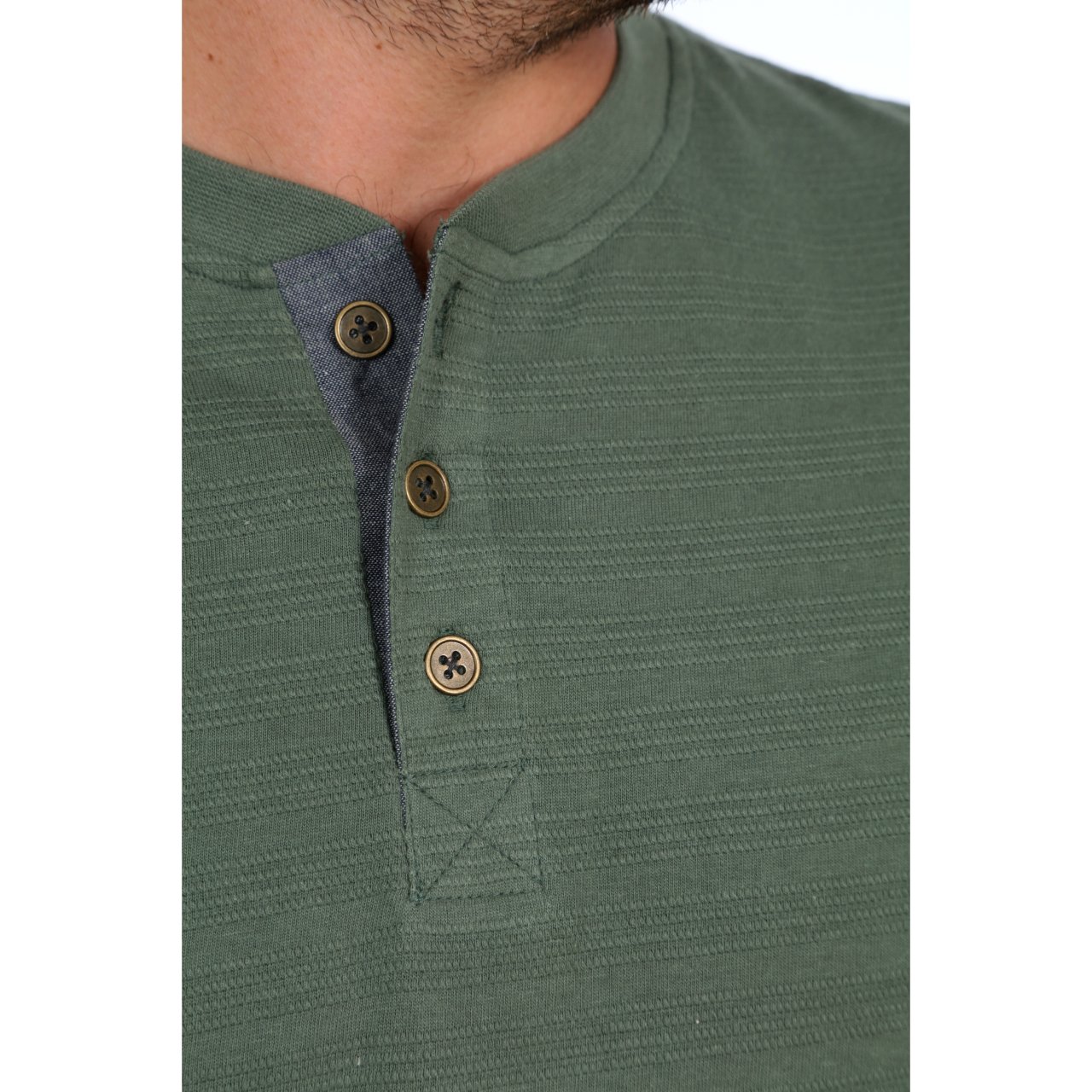 Clark Long Sleeve Henley in mystery green with striped pattern and chambray inner placket, showcasing its stylish design and eco-friendly fabric.