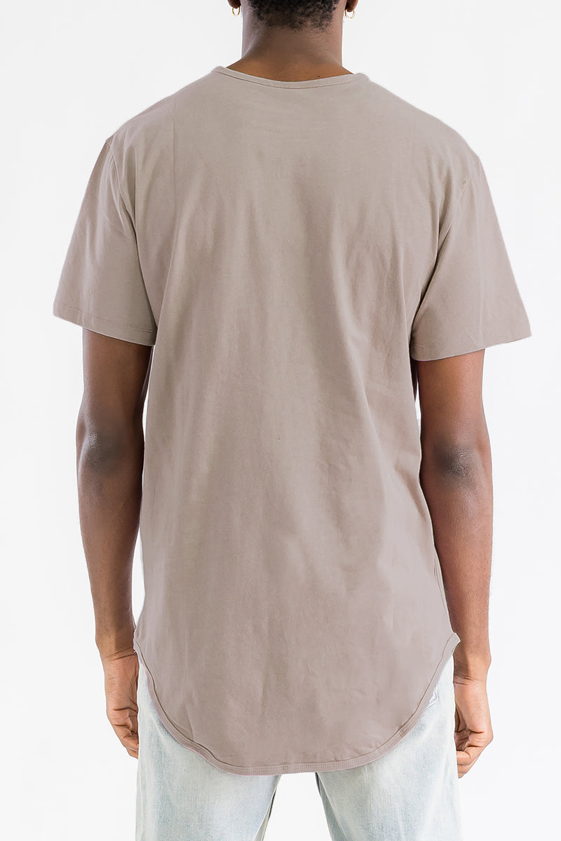 A stylish Classic Scallop Tee featuring a scallop extended rounded edge design, made from 100% cotton, displayed on a mannequin.