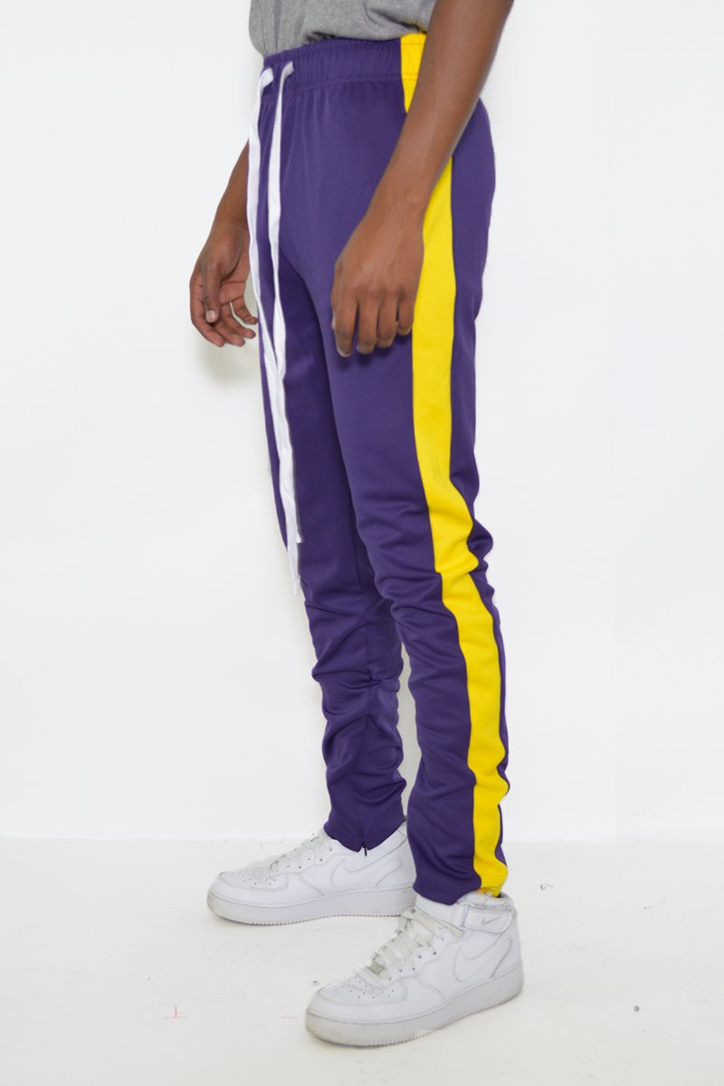 Classic Slim Fit Track Pants featuring a sleek design, single stripe detail, and hidden ankle zippers, perfect for active lifestyles.