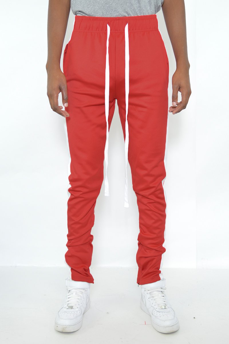 Classic slim fit track pants with single stripe detail and hidden ankle zipper, perfect for workouts and casual wear.