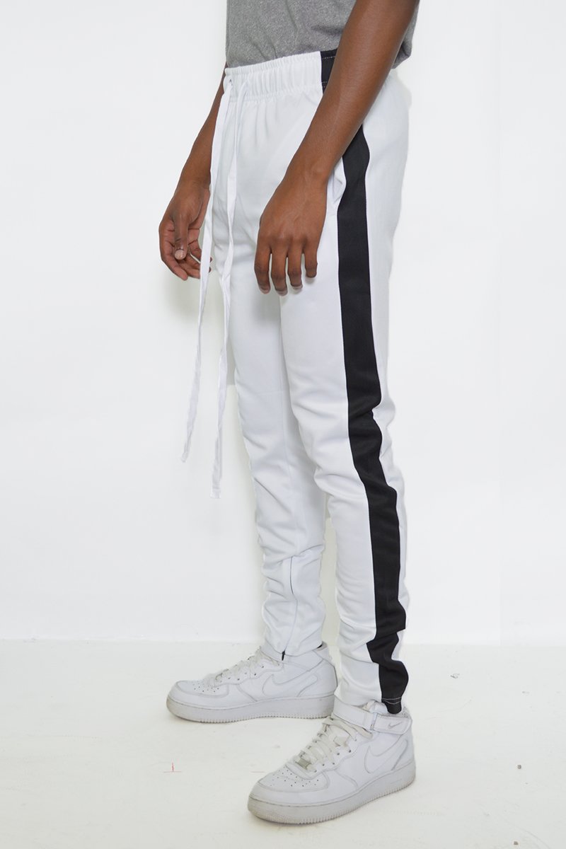 Classic Slim Fit Track Pants featuring a sleek design with a single stripe detail and hidden ankle zippers.