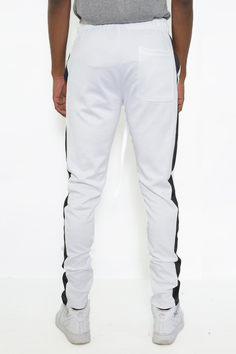 Classic Slim Fit Track Pants featuring a sleek design with a single stripe detail and hidden ankle zippers.