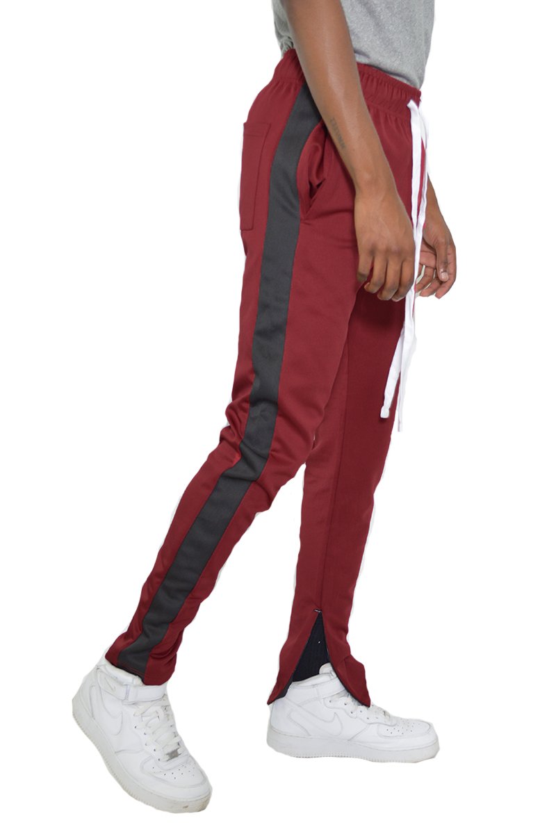 Classic Slim Fit Track Pants featuring a single stripe detail, tug-free zipper closure, and hidden ankle zipper, made from polyester and spandex.