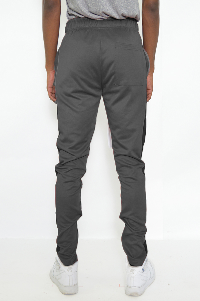 Classic slim fit track pants with single stripe detail and hidden ankle zipper, perfect for workouts and casual wear.