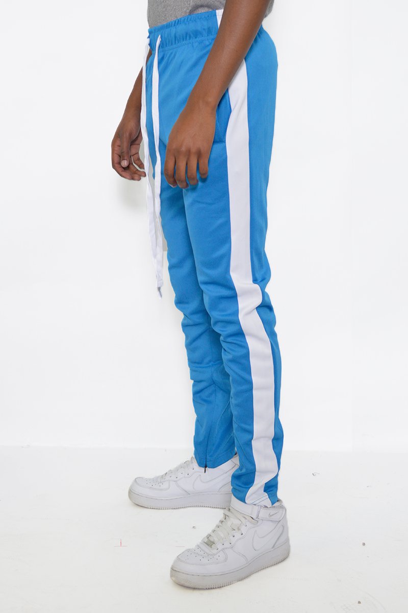 Classic Slim Fit Track Pants featuring a single stripe detail, tug-free zipper closure, and hidden ankle zipper, made from polyester and spandex.