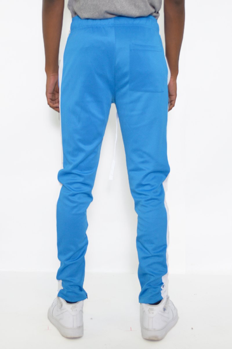 Classic Slim Fit Track Pants featuring a single stripe detail, tug-free zipper closure, and hidden ankle zipper, made from polyester and spandex.