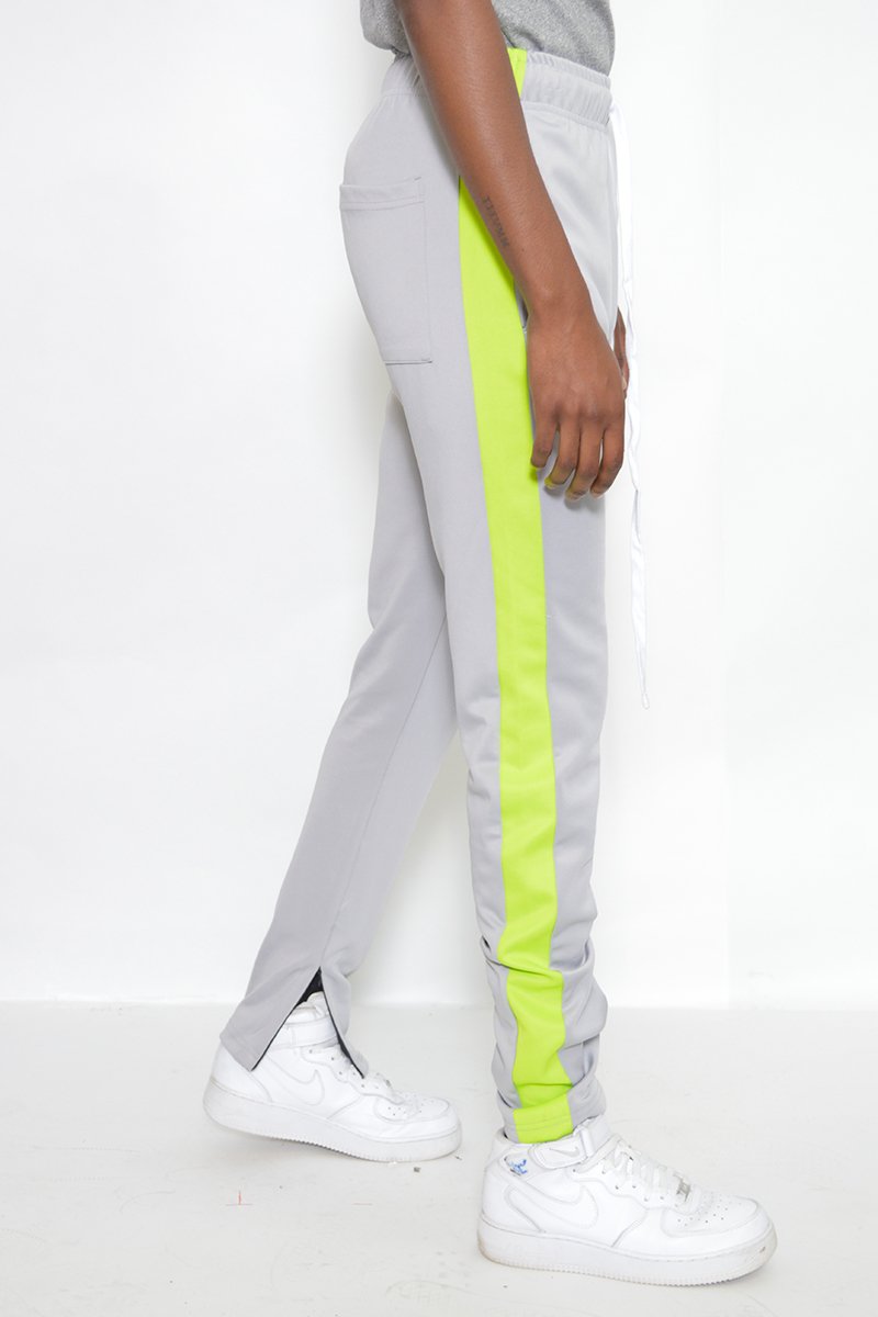 Classic Slim Fit Track Pants featuring a sleek design with single stripe detail and hidden ankle zippers, perfect for active lifestyles.