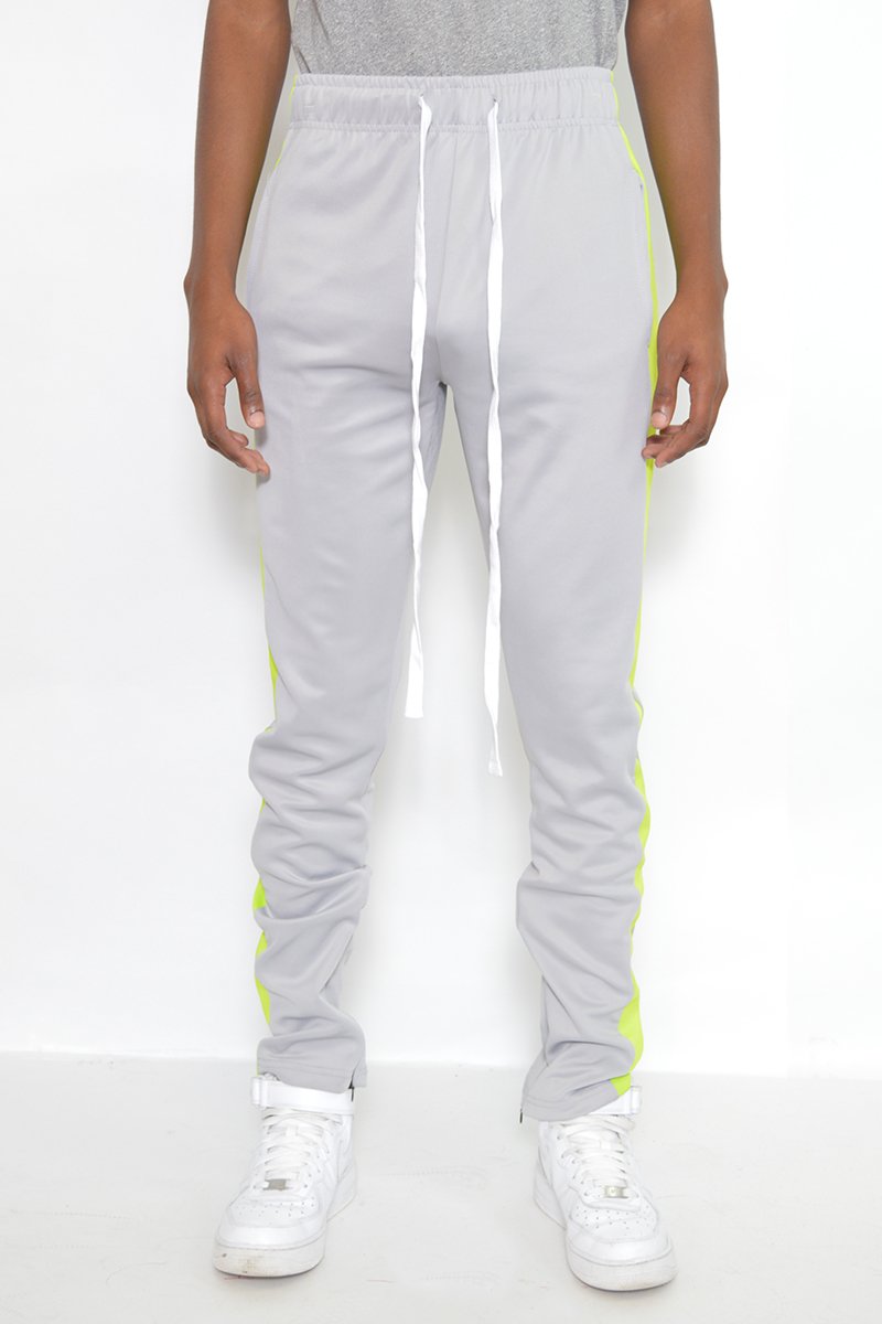 Classic Slim Fit Track Pants featuring a sleek design with single stripe detail and hidden ankle zippers, perfect for active lifestyles.