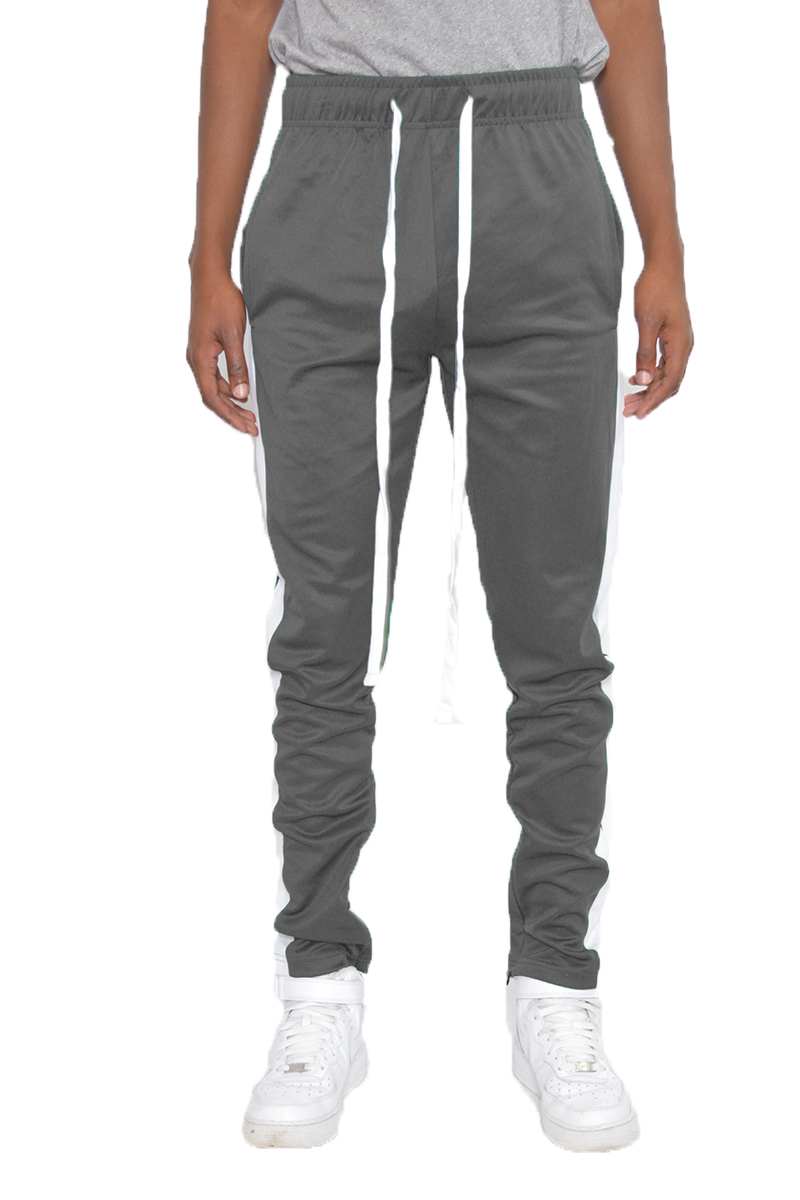 Classic Slim Fit Track Pants featuring a single stripe detail and hidden ankle zipper, modeled by a person standing at 5'11 wearing a Medium size.