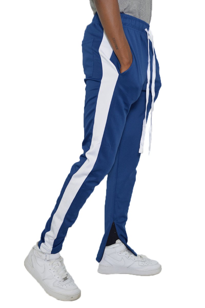 Classic Slim Fit Track Pants featuring a single stripe detail and hidden ankle zippers, modeled by a person standing at 5'11 wearing a Medium size.