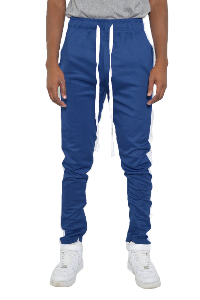 Classic Slim Fit Track Pants featuring a single stripe detail and hidden ankle zippers, modeled by a person standing at 5'11 wearing a Medium size.