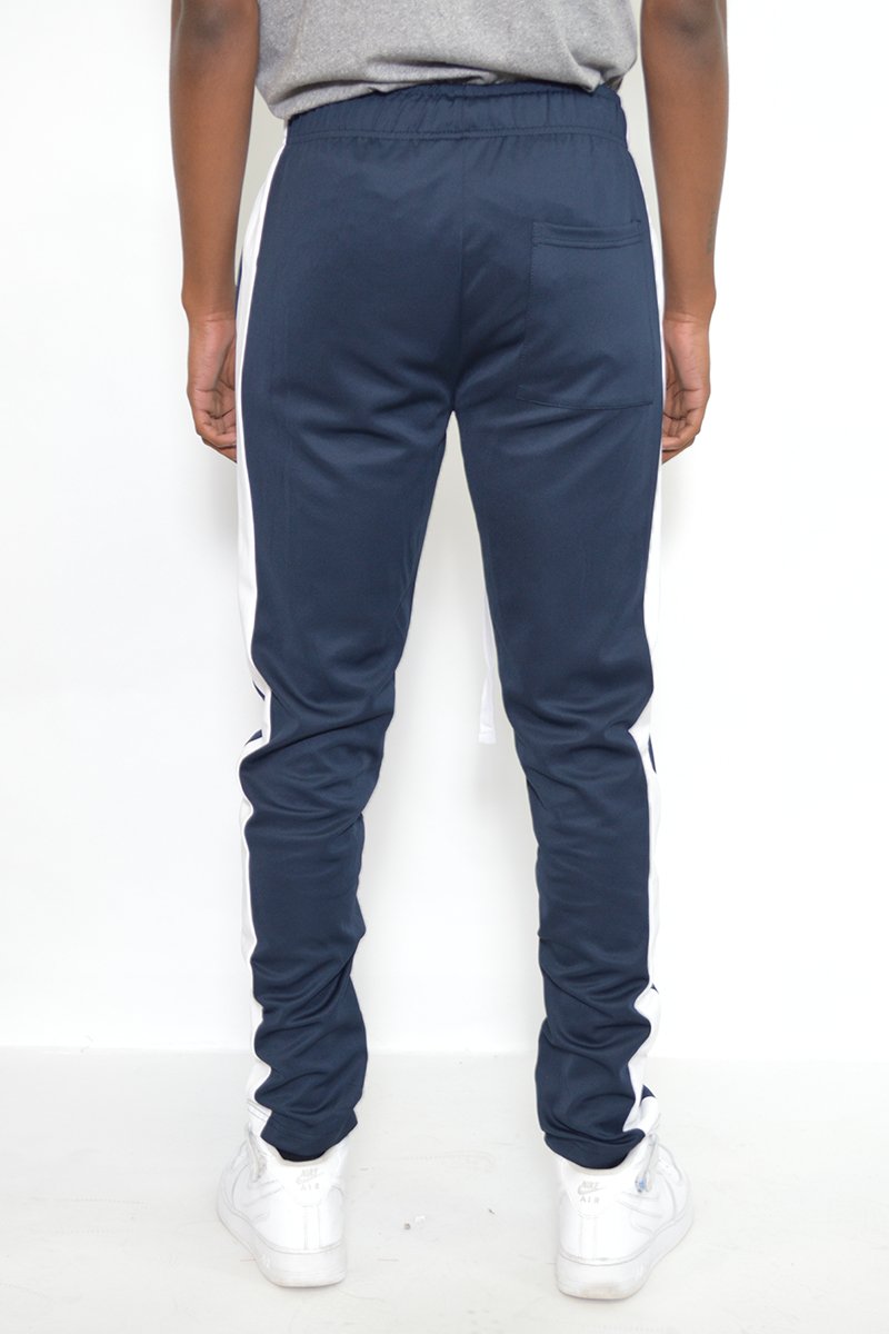 Classic Slim Fit Track Pants featuring a sleek design with a single stripe detail and hidden ankle zippers, perfect for active wear.