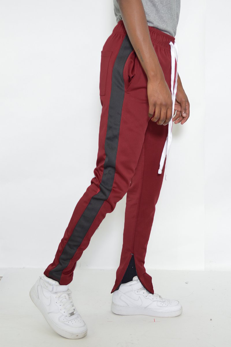 Classic Slim Fit Track Pants with single stripe detail and hidden ankle zipper, perfect for active lifestyles.