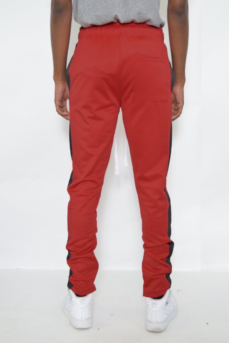 Classic Slim Fit Track Pants featuring a single stripe detail and hidden ankle zipper, designed for comfort and style.